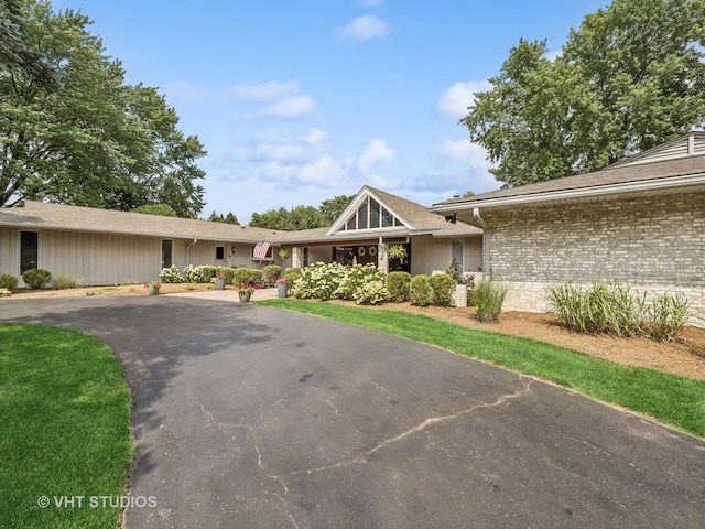 view of front of home with brick siding