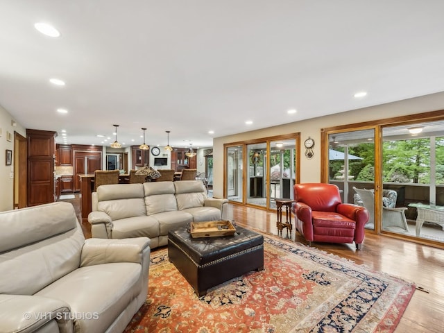 living room with wood finished floors and recessed lighting