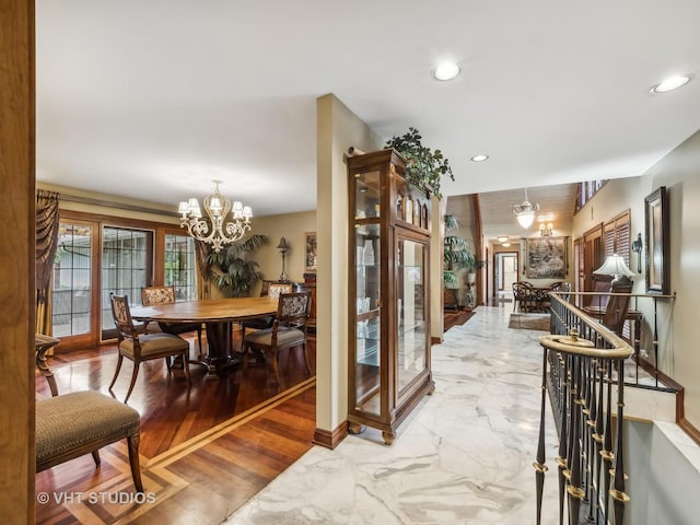 dining space with recessed lighting, a notable chandelier, marble finish floor, and baseboards