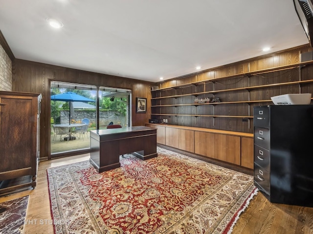 office space featuring wooden walls, recessed lighting, and light wood-style floors