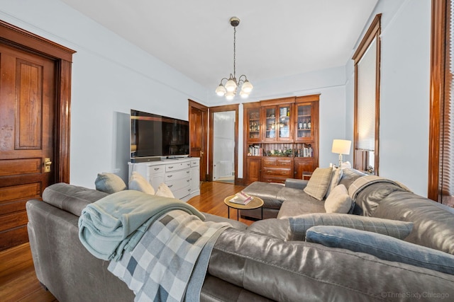 3615 N Janssen Ave, Chicago, IL 60613 - living area with an inviting chandelier, wood finished floors, and visible vents