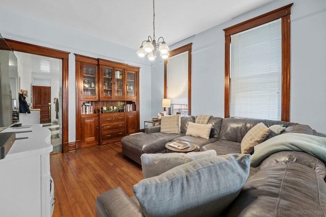 3615 N Janssen Ave, Chicago, IL 60613 - living room with wood finished floors and a notable chandelier