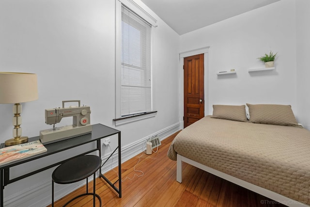 3615 N Janssen Ave, Chicago, IL 60613 - bedroom featuring baseboards and light wood-style flooring