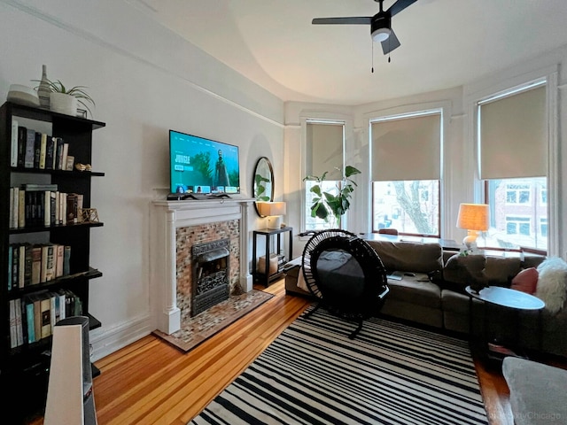 3615 N Janssen Ave, Chicago, IL 60613 - living room featuring wood finished floors, ceiling fan, and a fireplace