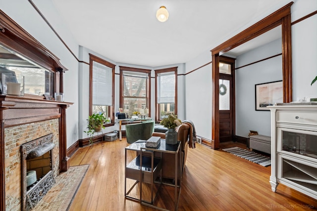 3615 N Janssen Ave, Chicago, IL 60613 - office featuring baseboards, a healthy amount of sunlight, a fireplace with flush hearth, and light wood finished floors