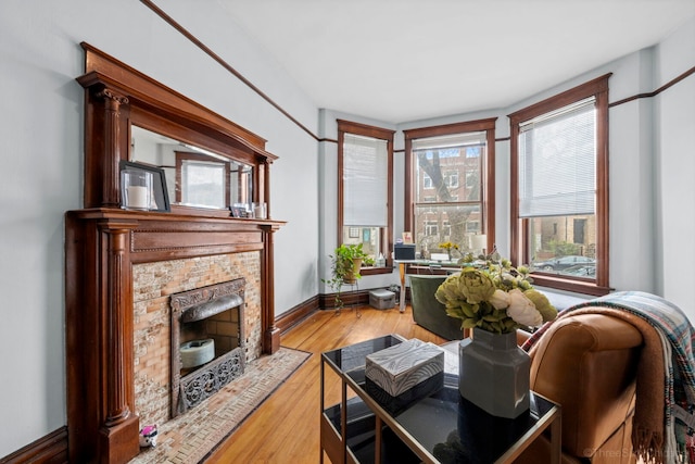 3615 N Janssen Ave, Chicago, IL 60613 - living area featuring baseboards, wood finished floors, and a fireplace