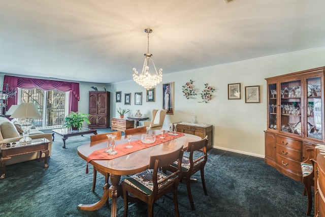 dining area with a chandelier, dark colored carpet, ornamental molding, and baseboards