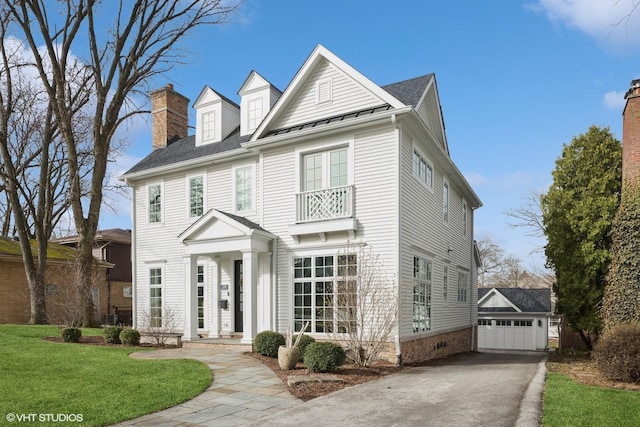 238 S Madison St, Hinsdale, IL 60521 - view of front of property with an outdoor structure, crawl space, a front yard, a garage, and a standing seam roof