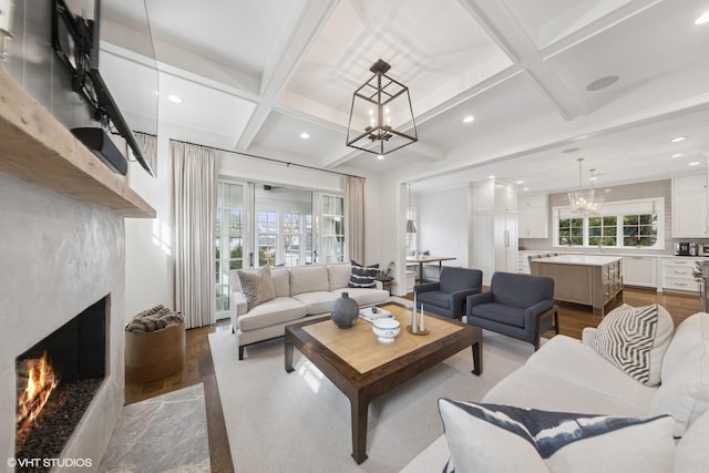 238 S Madison St, Hinsdale, IL 60521 - living room featuring a notable chandelier, a fireplace, recessed lighting, wood finished floors, and coffered ceiling