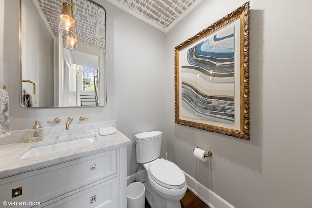 238 S Madison St, Hinsdale, IL 60521 - bathroom featuring toilet, wood finished floors, vanity, and baseboards