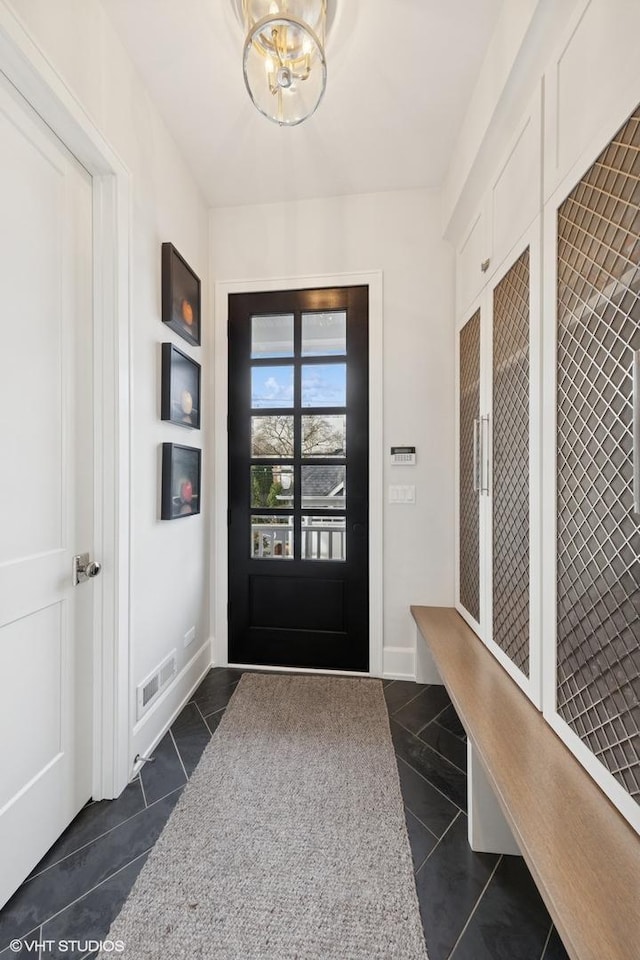 238 S Madison St, Hinsdale, IL 60521 - mudroom featuring a notable chandelier, dark tile patterned floors, and visible vents