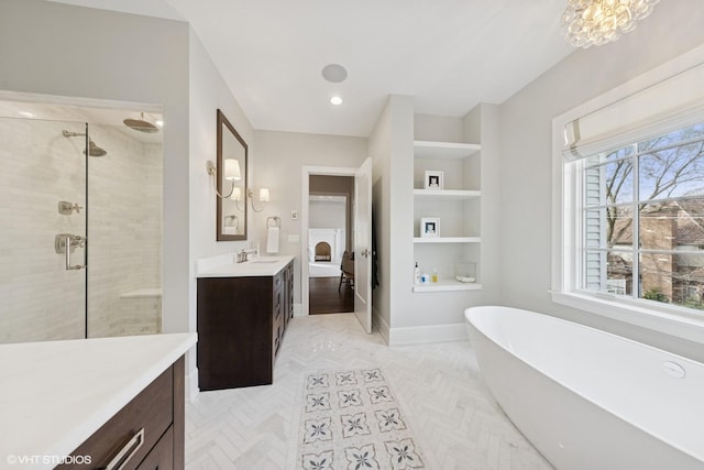 238 S Madison St, Hinsdale, IL 60521 - bathroom with built in features, baseboards, a freestanding bath, vanity, and a stall shower