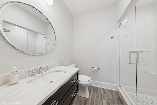 238 S Madison St, Hinsdale, IL 60521 - bathroom with baseboards, toilet, a shower stall, vanity, and wood finished floors