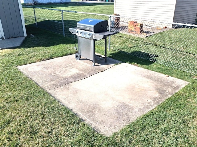 view of patio featuring area for grilling and fence
