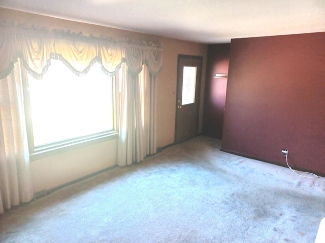 spare room featuring carpet flooring