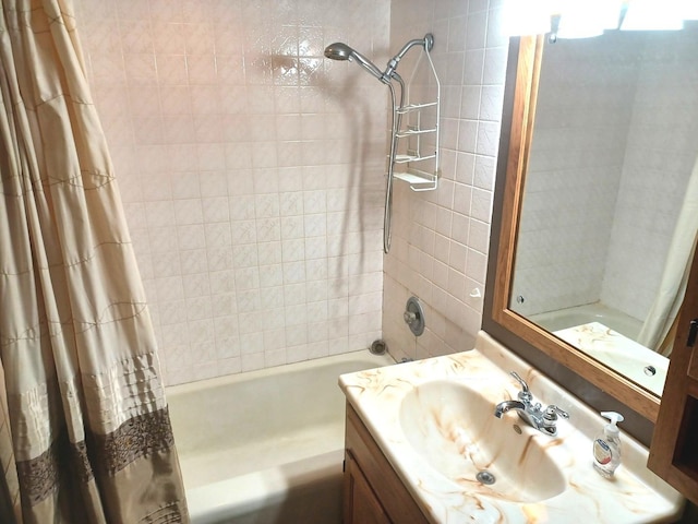 bathroom featuring shower / bath combination with curtain and vanity