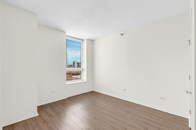 600 N Kingsbury St Unit 1114, Chicago, IL 60654 - unfurnished room featuring baseboards and wood finished floors
