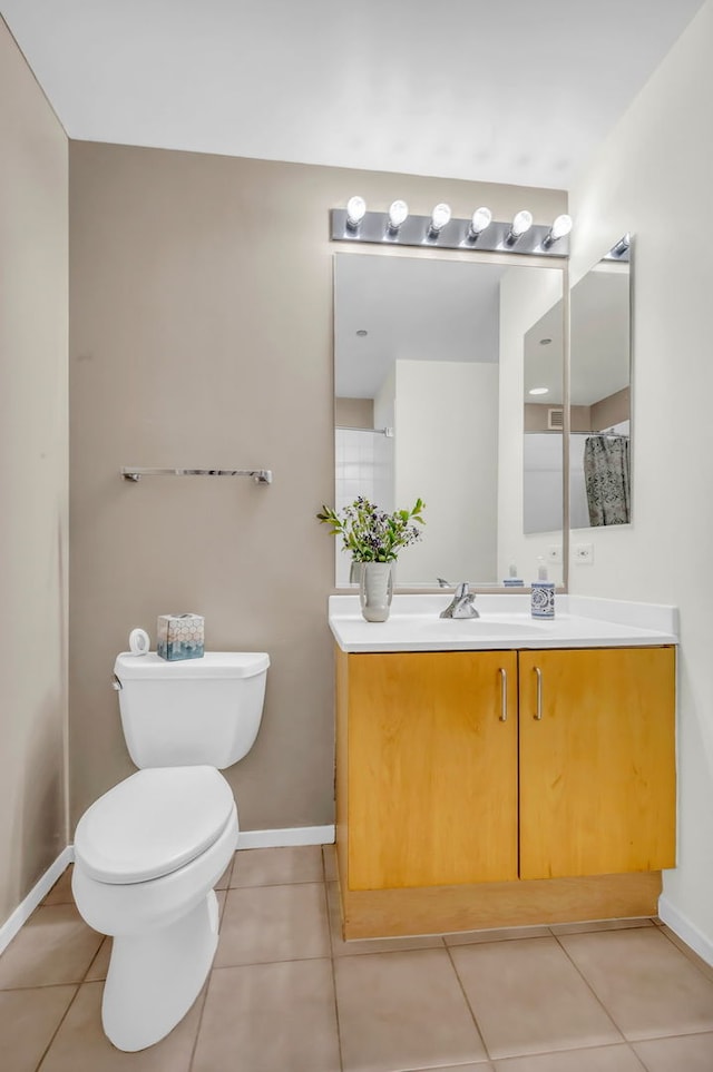 600 N Kingsbury St Unit 1114, Chicago, IL 60654 - bathroom featuring toilet, tile patterned floors, vanity, and baseboards