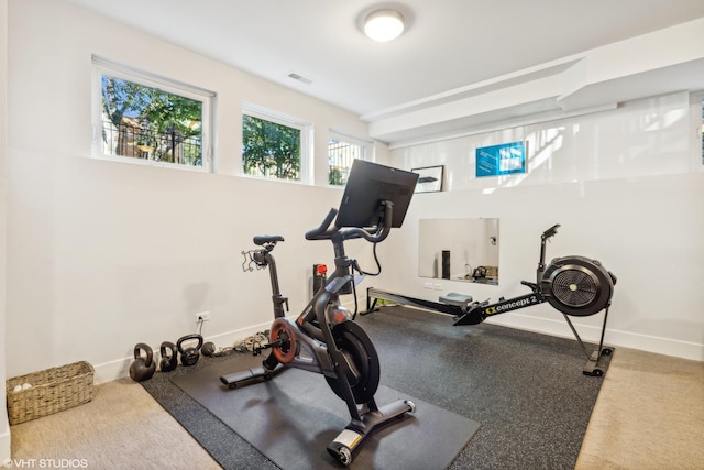 workout room with visible vents and baseboards