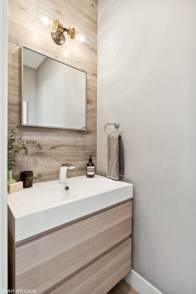 bathroom featuring baseboards and vanity