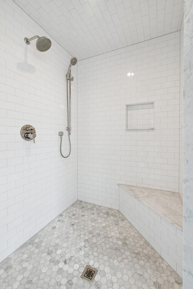 full bathroom featuring visible vents and a tile shower