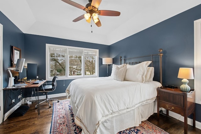 bedroom featuring wood finished floors, baseboards, and a ceiling fan