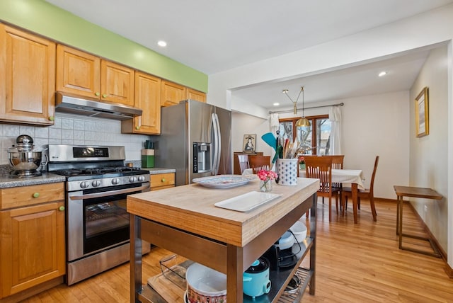 7925 Glen Ln, Darien, IL 60561 - kitchen featuring tasteful backsplash, appliances with stainless steel finishes, light wood-style floors, and under cabinet range hood