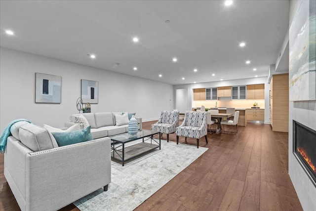 1560 Oakwood Ave Unit 205, Highland Park, IL 60035 - living area featuring a glass covered fireplace, recessed lighting, and dark wood finished floors