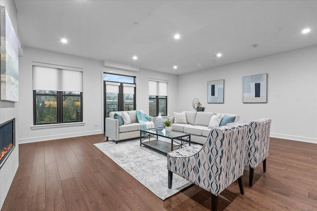 1560 Oakwood Ave Unit 205, Highland Park, IL 60035 - living area featuring baseboards, dark wood-style floors, a glass covered fireplace, and recessed lighting