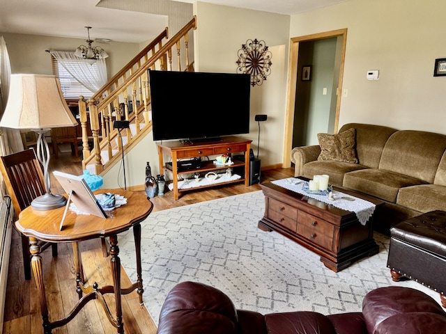 1409 Plain St, Peru, IL 61354 - living room featuring wood finished floors, baseboards, and stairway