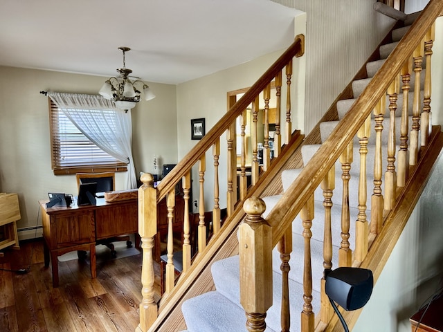 1409 Plain St, Peru, IL 61354 - stairs with baseboards, a notable chandelier, a baseboard radiator, and wood-type flooring