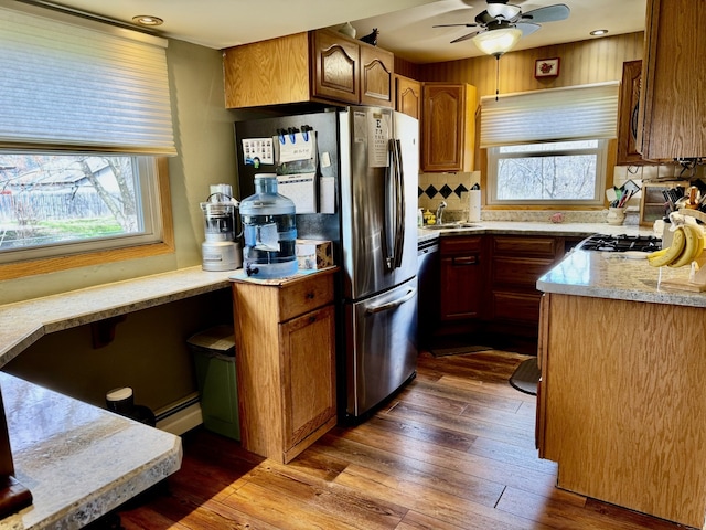 1409 Plain St, Peru, IL 61354 - kitchen with a ceiling fan, tasteful backsplash, a sink, and plenty of natural light