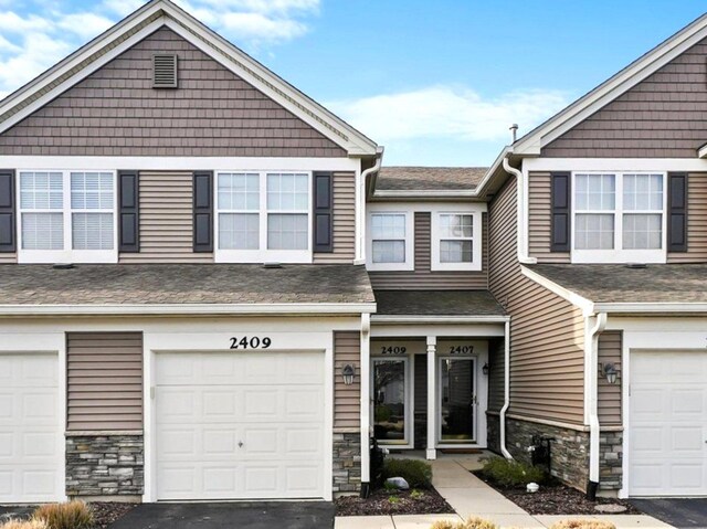 2409 Golf Ridge Cir, Naperville, IL 60563 - view of property with roof with shingles, a garage, and stone siding