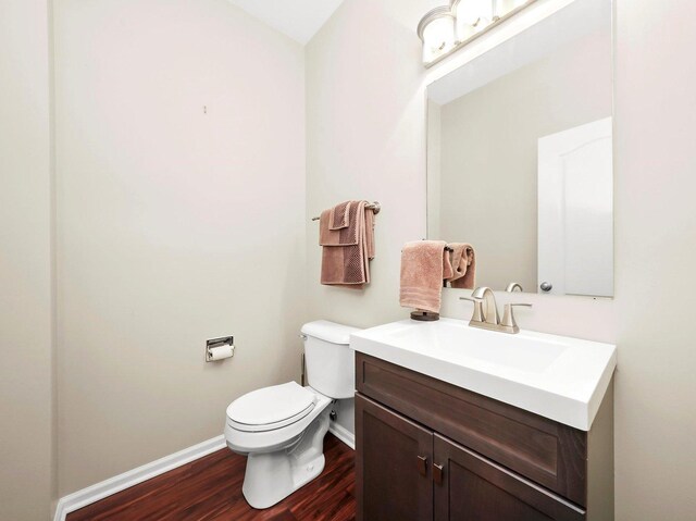 2409 Golf Ridge Cir, Naperville, IL 60563 - half bathroom with toilet, wood finished floors, vanity, and baseboards