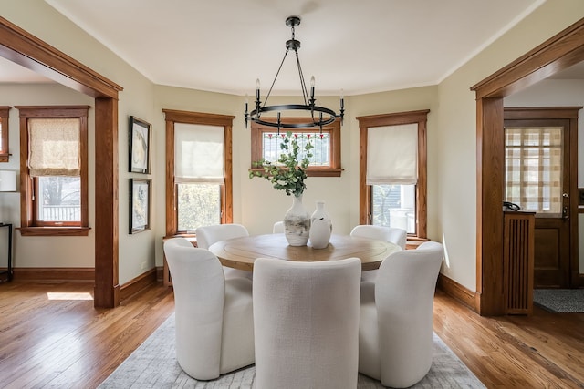 620 S Scoville Ave, Oak Park, IL 60304 - dining space featuring light wood finished floors, plenty of natural light, and an inviting chandelier
