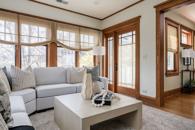 620 S Scoville Ave, Oak Park, IL 60304 - living area with light wood-style floors, plenty of natural light, crown molding, and baseboards