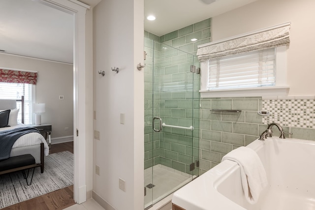 620 S Scoville Ave, Oak Park, IL 60304 - ensuite bathroom with a garden tub, baseboards, ensuite bathroom, and a stall shower