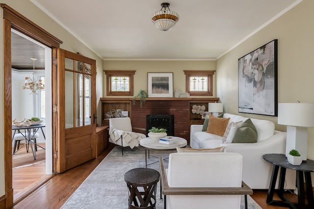 620 S Scoville Ave, Oak Park, IL 60304 - living area with a wealth of natural light, ornamental molding, a brick fireplace, and wood finished floors