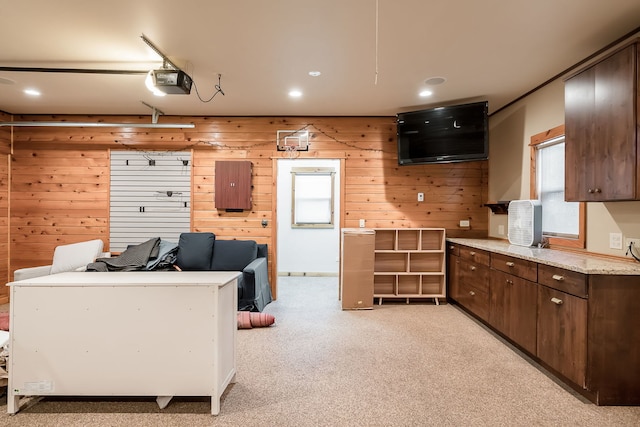 620 S Scoville Ave, Oak Park, IL 60304 - kitchen with recessed lighting, wooden walls, dark brown cabinets, and light carpet