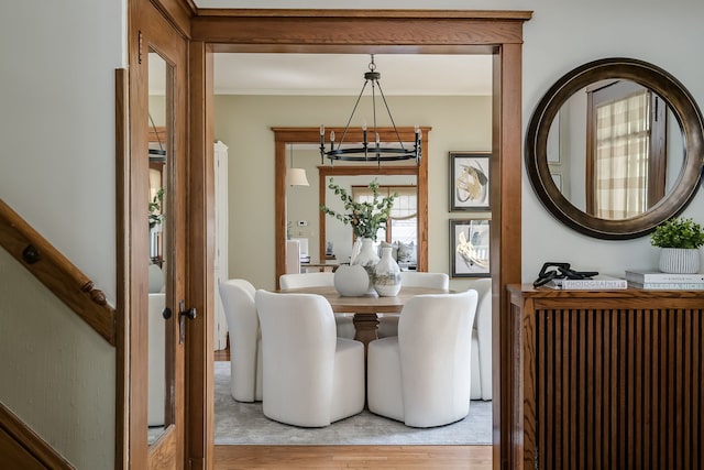 620 S Scoville Ave, Oak Park, IL 60304 - dining area featuring ornamental molding, a notable chandelier, and light wood-style floors