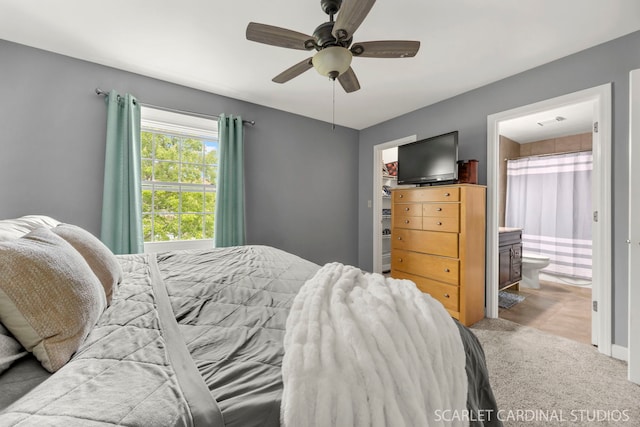 2690 Moss Ln, Aurora, IL 60504 - bedroom featuring ensuite bath, carpet floors, a spacious closet, and a ceiling fan