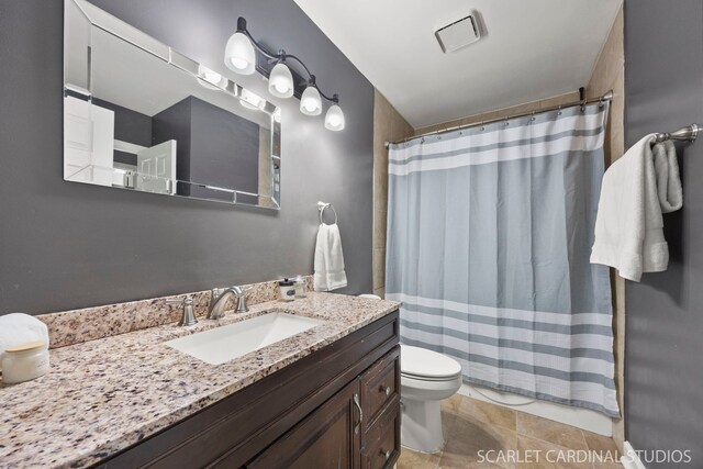 2690 Moss Ln, Aurora, IL 60504 - bathroom featuring toilet, vanity, curtained shower, and tile patterned flooring