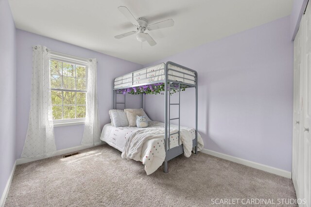 2690 Moss Ln, Aurora, IL 60504 - carpeted bedroom with baseboards, a closet, and a ceiling fan