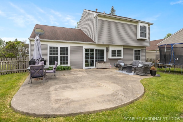 2690 Moss Ln, Aurora, IL 60504 - back of house featuring a trampoline, outdoor lounge area, and a patio