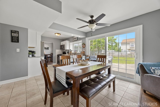 2690 Moss Ln, Aurora, IL 60504 - dining space with ceiling fan, light tile patterned flooring, and baseboards