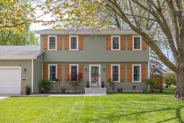 colonial-style house with a garage and a shingled roof