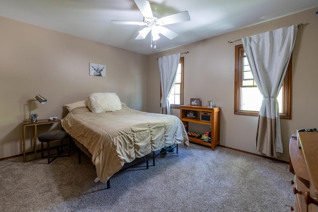 bedroom with carpet flooring, a ceiling fan, and baseboards
