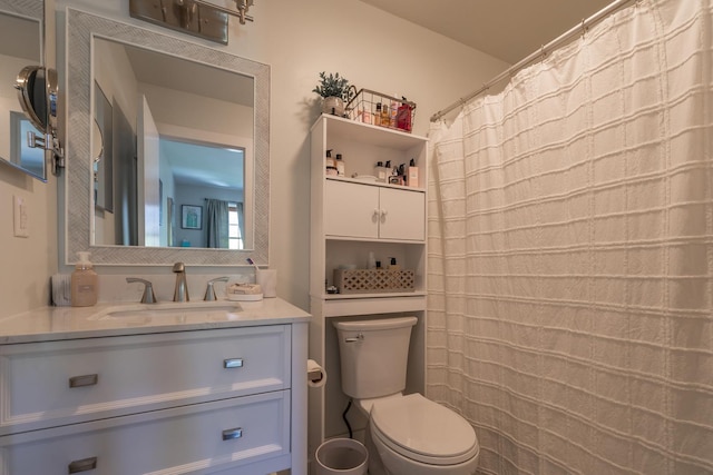 bathroom with toilet and vanity