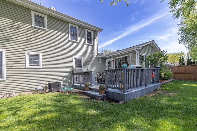 back of property featuring a deck and central AC unit