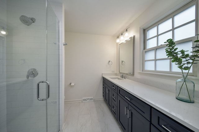 1007 Canonero Dr, Naperville, IL 60540 - bathroom featuring vanity, visible vents, marble finish floor, a stall shower, and baseboards